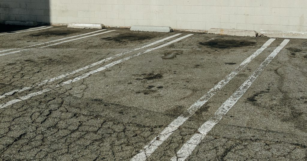 This meme is an image of a parking lot with a series of white lines on the ground, but the lines are all crooked and uneven. The text "I'm not lazy, I'm just on energy-saving mode" is written above the image. The meme is likely referencing the idea that the person is not actually lazy, but rather conserving energy by not exerting themselves in a physical or mental way.